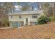 Charming home featuring stone accents and a well-maintained front yard on a wooded lot at 4690 Big Valley Ct, Stone Mountain, GA 30083