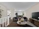 Inviting living room featuring modern decor and seamless flow to the dining area at 4690 Big Valley Ct, Stone Mountain, GA 30083