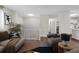 Comfortable living room with stylish furniture, neutral tones, and easy access to the kitchen and other living spaces at 4690 Big Valley Ct, Stone Mountain, GA 30083