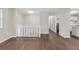 Open floor plan with hardwood floors, white banister, and bright walls at 4690 Big Valley Ct, Stone Mountain, GA 30083