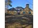 Back view of home with ample backyard space at 104 Oak Bend Dr, Stockbridge, GA 30281