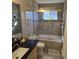 Bathroom featuring shower-over-tub, granite countertop and stainless steel fixtures at 104 Oak Bend Dr, Stockbridge, GA 30281