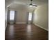Well-lit bedroom with ceiling fan, hardwood floors, and neutral paint, offering a peaceful retreat at 104 Oak Bend Dr, Stockbridge, GA 30281