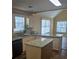 Eat-in kitchen with granite counters, stainless appliances, and a kitchen island at 104 Oak Bend Dr, Stockbridge, GA 30281