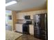 Modern kitchen with stainless steel appliances, granite countertops, and ample cabinet space at 104 Oak Bend Dr, Stockbridge, GA 30281
