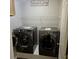 Modern washer and dryer in laundry room with shelving at 104 Oak Bend Dr, Stockbridge, GA 30281