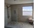 Modern walk-in shower with pebble floor, tiled walls, and glass enclosure for a spa-like experience at 104 Oak Bend Dr, Stockbridge, GA 30281
