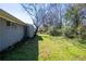 Spacious backyard with lush green grass and some shade, offering room for outdoor activities at 1393 Vesta Ave, Atlanta, GA 30344