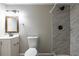 Bathroom features a vanity, toilet, and tiled shower at 1393 Vesta Ave, Atlanta, GA 30344