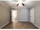 Bedroom with ceiling fan, wood floor and access to bathroom at 1393 Vesta Ave, Atlanta, GA 30344