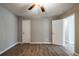 Bedroom with neutral walls, ceiling fan, and wood-look laminate flooring at 1393 Vesta Ave, Atlanta, GA 30344