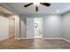 Spacious bedroom showcasing wood-look floors and access to a bathroom and large closet space at 1393 Vesta Ave, Atlanta, GA 30344