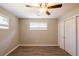Bedroom with ceiling fan, wood-look floors, and a closet provides a simple, organized space at 1393 Vesta Ave, Atlanta, GA 30344
