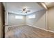 Bright bedroom with wood-look floors, ceiling fan, and well-lit with windows, promoting a comfortable space at 1393 Vesta Ave, Atlanta, GA 30344