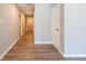 Inviting hallway with wood-look floors and neutral wall colors, creating a warm and welcoming atmosphere at 1393 Vesta Ave, Atlanta, GA 30344