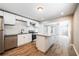 Modern kitchen featuring white cabinets, granite countertops, and stainless steel appliances at 1393 Vesta Ave, Atlanta, GA 30344