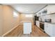 Modern kitchen featuring white cabinets, granite countertops, and stainless steel appliances at 1393 Vesta Ave, Atlanta, GA 30344