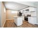 Modern kitchen featuring white cabinets, granite countertops, and stainless steel appliances at 1393 Vesta Ave, Atlanta, GA 30344