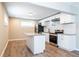 Modern kitchen featuring white cabinets, granite countertops, and stainless steel appliances at 1393 Vesta Ave, Atlanta, GA 30344