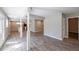 Spacious open-concept living room with sleek floors leading to the kitchen and front door at 1393 Vesta Ave, Atlanta, GA 30344