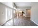 Open-concept living room with modern flooring and easy access to the kitchen at 1393 Vesta Ave, Atlanta, GA 30344