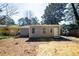 Backyard view featuring neutral siding, a stepping stone pathway, and an open yard at 1780 Brewer Sw Blvd, Atlanta, GA 30310