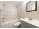 Bathroom featuring a bathtub, shower combo, with modern sink and vanity at 1780 Brewer Sw Blvd, Atlanta, GA 30310