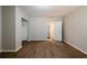 Bedroom featuring wood flooring, a closet, and door leading to hallway at 1780 Brewer Sw Blvd, Atlanta, GA 30310
