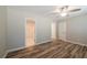 Well-lit bedroom featuring new floors and access to the bathroom at 1780 Brewer Sw Blvd, Atlanta, GA 30310