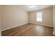 Bedroom featuring wood flooring and a window allowing natural light at 1780 Brewer Sw Blvd, Atlanta, GA 30310