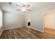 Spacious bedroom boasts wood-look floors, a modern ceiling fan, and access to both a bathroom and closet at 1780 Brewer Sw Blvd, Atlanta, GA 30310