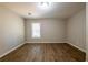 Bedroom with hardwood floors and a window to let in natural light at 1780 Brewer Sw Blvd, Atlanta, GA 30310
