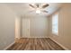 Well-lit bedroom features wood-look floors, neutral walls, and a ceiling fan for added comfort at 1780 Brewer Sw Blvd, Atlanta, GA 30310