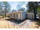 Exterior view of the home featuring neutral colored siding, a white door, and a stepping stone walkway at 1780 Brewer Sw Blvd, Atlanta, GA 30310