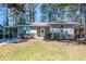 Charming single-story home featuring a well-maintained lawn and inviting front entrance at 1780 Brewer Sw Blvd, Atlanta, GA 30310