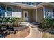Inviting front entrance with an oval window door and manicured landscaping at 1780 Brewer Sw Blvd, Atlanta, GA 30310