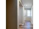 Hallway view with wood-look flooring and white doors at 1780 Brewer Sw Blvd, Atlanta, GA 30310