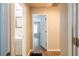 Hallway with neutral color, with doors leading to bathroom and bedroom at 1780 Brewer Sw Blvd, Atlanta, GA 30310