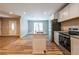 Bright kitchen features white cabinets, stainless steel appliances, granite counters, and an island with a sink at 1780 Brewer Sw Blvd, Atlanta, GA 30310