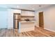 Bright kitchen features white cabinets, stainless steel appliances, granite counters, and an island with a sink at 1780 Brewer Sw Blvd, Atlanta, GA 30310
