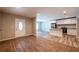 Open-concept living space flowing into a modern kitchen with stainless steel appliances at 1780 Brewer Sw Blvd, Atlanta, GA 30310