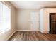 Living room features ample natural light and new wood-look flooring next to the kitchen at 1780 Brewer Sw Blvd, Atlanta, GA 30310