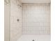 Tiled shower stall with a modern shower head and tiled floor at 1780 Brewer Sw Blvd, Atlanta, GA 30310