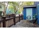 Inviting backyard deck with blue shed and modern seating arrangement at 206 Reinhardt St Se, Atlanta, GA 30312