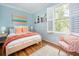 Cozy bedroom with natural light, stylish decor, and hardwood floors at 206 Reinhardt St Se, Atlanta, GA 30312