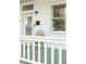 Charming white front porch with a chair and green-painted floor at 206 Reinhardt St Se, Atlanta, GA 30312