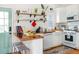 Well lit white kitchen featuring stainless steel appliances, counter stools and lots of storage at 206 Reinhardt St Se, Atlanta, GA 30312