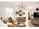 Bright living room with stylish decor, unique chandelier, and lots of seating at 206 Reinhardt St Se, Atlanta, GA 30312