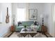 Comfortable living room showcasing a blue sofa, modern art, and stylish end tables at 206 Reinhardt St Se, Atlanta, GA 30312