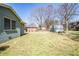 The home has a large and grassy backyard with mature trees and partial fencing at 264 Silver Springs Sw Cir, Atlanta, GA 30310